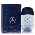 Mercedes-Benz The Move Live The Moment 3.4 oz men's EDP. Sleek blue and silver bottle with iconic logo, next to its dark blue box.