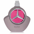 Mercedes Benz Woman Eau De Parfum Tester. Sleek gray bottle, silver cap, iconic logo, and vibrant pink accent.