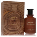 Michael Malul Wood + Cardamom 3.4 oz EDP. Rich amber bottle with sleek black cap, paired with a distinctive wood grain box.