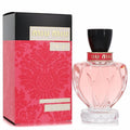 Miu Miu Twist Eau De Parfum: a stunning pink faceted glass bottle with a black cap, paired with its vibrant red and black ornate box.