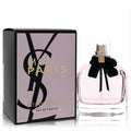 Elegant YSL Mon Paris 3.04 oz Eau De Parfum. Clear bottle with soft pink liquid, chic black bow, and stylish pink & black box.