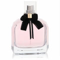 Mon Paris YSL Eau De Parfum spray: elegant faceted glass bottle, soft pink fragrance, chic black velvet bow with gold logo.