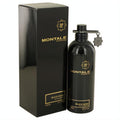 Montale Black Aoud 3.4 oz unisex EDP. Premium black metal bottle with gold logo and charm, alongside its elegant box.