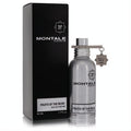 Montale Fruits of The Musk 1.7 oz EDP: sleek metallic silver bottle with unique charm, next to its elegant black box.