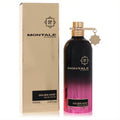 Montale Golden Sand 3.4 oz EDP. Elegant black-to-pink gradient bottle with gold cap & charm, beside its luxurious gold box.