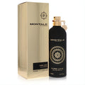 Montale Pure Love 3.4oz EDP. Sleek black bottle with gold cap, charm, and ornate design, displayed with its shimmering gold box.
