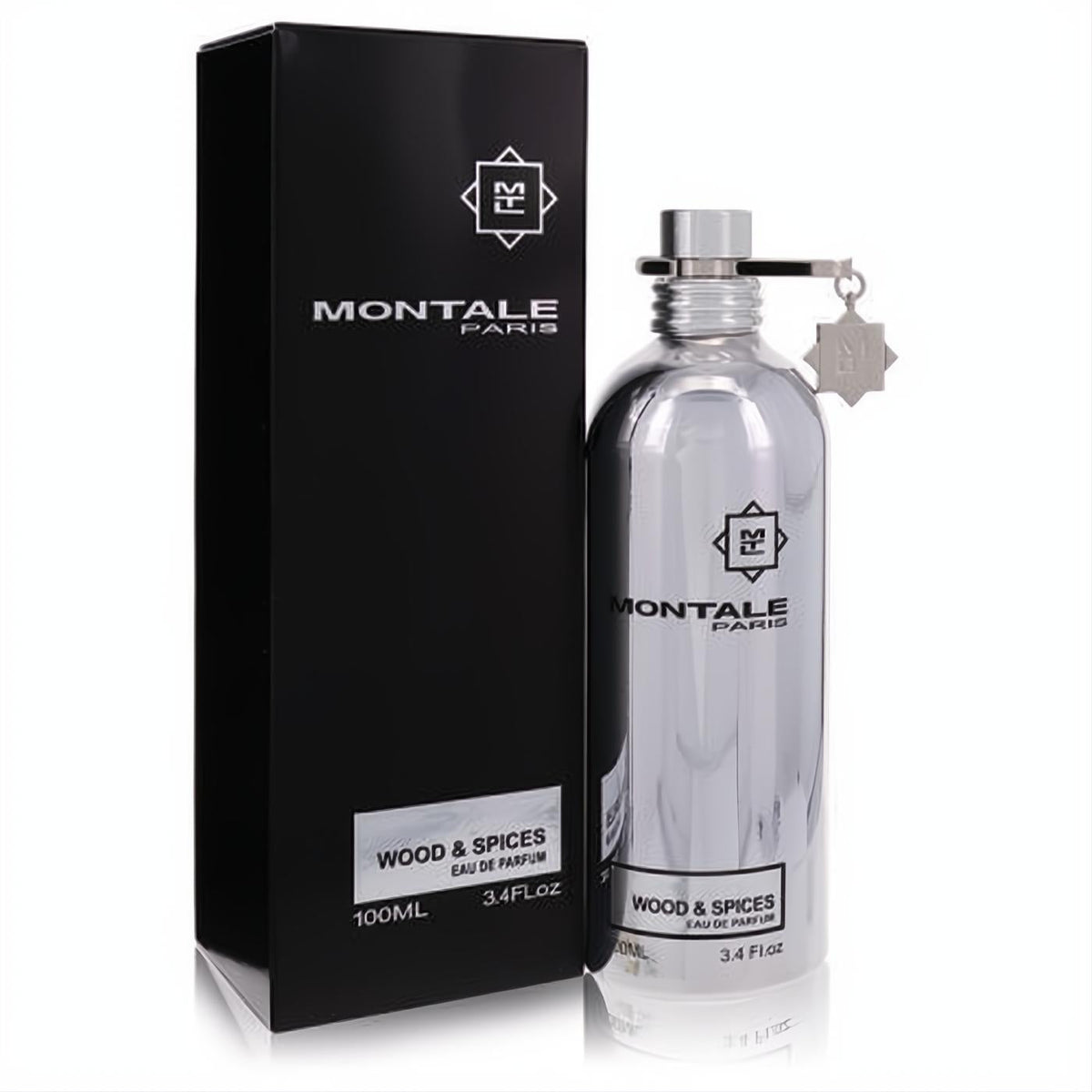 Sleek Montale Wood & Spices 3.4 oz Eau de Parfum. Iconic silver metallic bottle with charm next to its elegant black box.