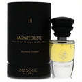Montecristo by Masque Milano unisex EDP. Luxurious black box and clear bottle with golden liquid, a distinctive ridged black cap.