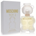 Moschino Toy 2 women's 3.4 oz Eau De Parfum. Playful clear glass teddy bear bottle with frosted head, light yellow fragrance, and white box with gold details.
