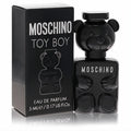 Experience Moschino Toy Boy .17 oz mini EDP. Bold black teddy bear bottle and sleek matching box.