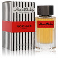Moustache by Rochas 2.5 oz men's Eau De Parfum. Amber liquid in a ribbed glass bottle, beside its striking black striped box with a red band.