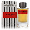 Moustache by Rochas 4.1 oz men's EDP. Distinctive clear ribbed glass bottle with amber fragrance, bold red label, and striking striped box.