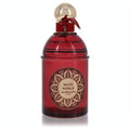 Luxurious Guerlain Musc Noble perfume in a rich red glass bottle with intricate gold label, elegant gold cap, and velvet ribbon.