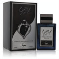 Luxurious Najum Al Shuyukh Khusoosi 3 oz men's EDP. Dark blue glass bottle with textured metallic cap, next to its sleek black and silver box.