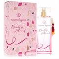 Chic Nanette Lepore Beauty Abroad 3.4 oz pink EDP spray bottle with gold cap, beaded tassel, and vibrant terrazzo-patterned box.