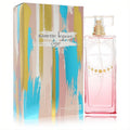 Nanette Lepore Luna 3.4 oz EDP: chic pink bottle with gold cap and sun design, paired with a vibrant abstract art box.