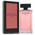 Chic Narciso Rodriguez Musc Noir Rose 3.3 oz EDP. Sleek pink glass bottle with black cap, next to its elegant black and rose box.