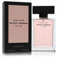Narciso Rodriguez Musc Noir 1.6 oz Eau de Parfum. Chic clear glass bottle with blush pink fragrance, sleek black cap, and elegant black box.