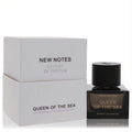 New Notes Queen Of The Sea Extrait De Parfum 1.7 oz. Elegant dark glass bottle with black cap, beside its crisp white luxury box.
