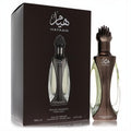 Exquisite Niche Emarati Hayaam 3.4 oz unisex EDP. Distinctive dark bronze bottle with clear glass and ornate cap, showcased with its elegant brown box.