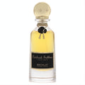 Luxurious Nicolai Patchouli Sublime Elixir De Parfum in a clear glass bottle with golden liquid, black label, ornate gold cap, and black rose accent.