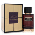 Iconic Carolina Herrera Nightfall Patchouli unisex EDP. Dark red glass bottle, black cap, gold base, and elegant gold box.