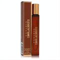 Discover Elizabeth and James Nirvana Bourbon .34 oz women's rollerball EDP. Sleek amber bottle, gold cap, and elegant brown box.