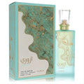 Nusuk Azuree 2.7 oz Eau De Parfum. Frosted aqua bottle with elegant gold swirl design and clear cap, beside its matching box.