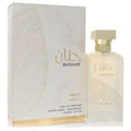 Exquisite Nusuk Hanaan 3.4 oz EDP spray. Clear bottle with gold cap, beside its elegant white and gold patterned box.