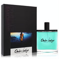 Olfactive Studio Ombre Indigo 3.4 oz unisex EDP. Vibrant turquoise perfume in sleek glass bottle with elegant black box.