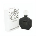 Ombre Rose by Brosseau .25 oz pure perfume. Elegant black bottle with embossed floral design, white cap, and matching white box.