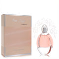 Elegant Reyane Tradition One Day in Provence 3.3 oz women's perfume. Pink liquid in clear glass bottle with silver cap, beside peach box.