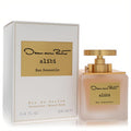 Oscar De La Renta Alibi Eau Sensuelle 3.4 oz EDP. Luxurious frosted glass bottle, elegant gold cap, and white textured box.