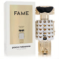 Dazzling Paco Rabanne Fame gold robot perfume bottle with white scale dress, chic sunglasses, and its stylish refillable packaging.