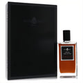 Affinessence Patchouli Oud 3.4 oz unisex EDP. Clear glass bottle with rich amber liquid, silver label, black cap, and sleek black gift box.