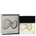 Peau De Pierre by Starck Paris 1.35 oz EDT. Elegant clear glass bottle with unique wavy yellow fragrance and sleek black cap.