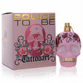 Bold Police To Be Tattoo Art 4.2 oz women's EDP. Pink skull bottle with vibrant red rose tattoo art, gold cap, and matching box.