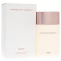 Porsche Design Woman Eau de Parfum 3.4 oz. Sleek cream bottle with a luxurious rose gold cap, displayed with its elegant white box.