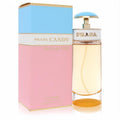 Prada Candy Sugar Pop 2.7 oz EDP. Clear bottle with golden liquid, iconic blue cap, and a vibrant pink & blue box.