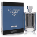 Elevate your style with Prada L'Homme L'eau 3.4 oz EDT. Clear glass bottle, silver cap, blue accents, and sleek blue box.