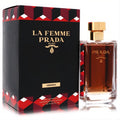 Prada La Femme Absolu 3.4 oz EDP. Amber fragrance in a sleek glass bottle with gold cap, beside its black and red patterned box.