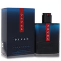 Prada Luna Rossa Ocean 3.3 oz EDT. Elegant dark blue bottle with a vibrant red stripe, showcasing the iconic Prada logo. Includes matching retail box.