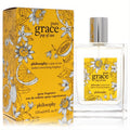 Pure Grace Pop Of Sun 4 oz EDT spray. Elegant clear glass bottle, vibrant yellow box with cheerful floral citrus design.