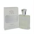 Creed Royal Water 4 oz Millesime spray. Clear glass bottle with silver cap and white embossed box, exuding luxury and elegance.