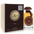 Luxurious Lattafa Ra'ed Oud unisex EDP, 3.4 oz. Amber liquid in elegant bottle with brown cap, gold accents, and matching box.