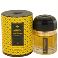 Ramon Monegal Hand in Hand Rose & Oud 1.7 oz EDP. Elegant faceted glass bottle, black cap, and distinctive yellow patterned box.