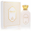Luxurious Rayef Awwal Musk 3.4 oz unisex EDP. White bottle with gold cap and matching box, featuring elegant Arabic script and patterns.