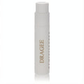 Sleek frosted white Reminiscence Dragee .04 oz perfume vial with elegant gold text.