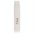 Elegant white Reminiscence Oud perfume sample vial, .04 oz, featuring "Oud" in rich brown. Experience luxury.