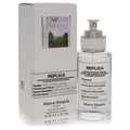 Maison Margiela Replica When The Rain Stops 1 oz EDT. Fresh rain scent in an elegant clear bottle, iconic rainbow box.
